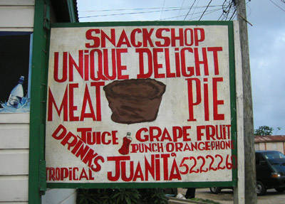 Hand Painted Sign. Unique delight meat pie. Dangriga Town, Belize